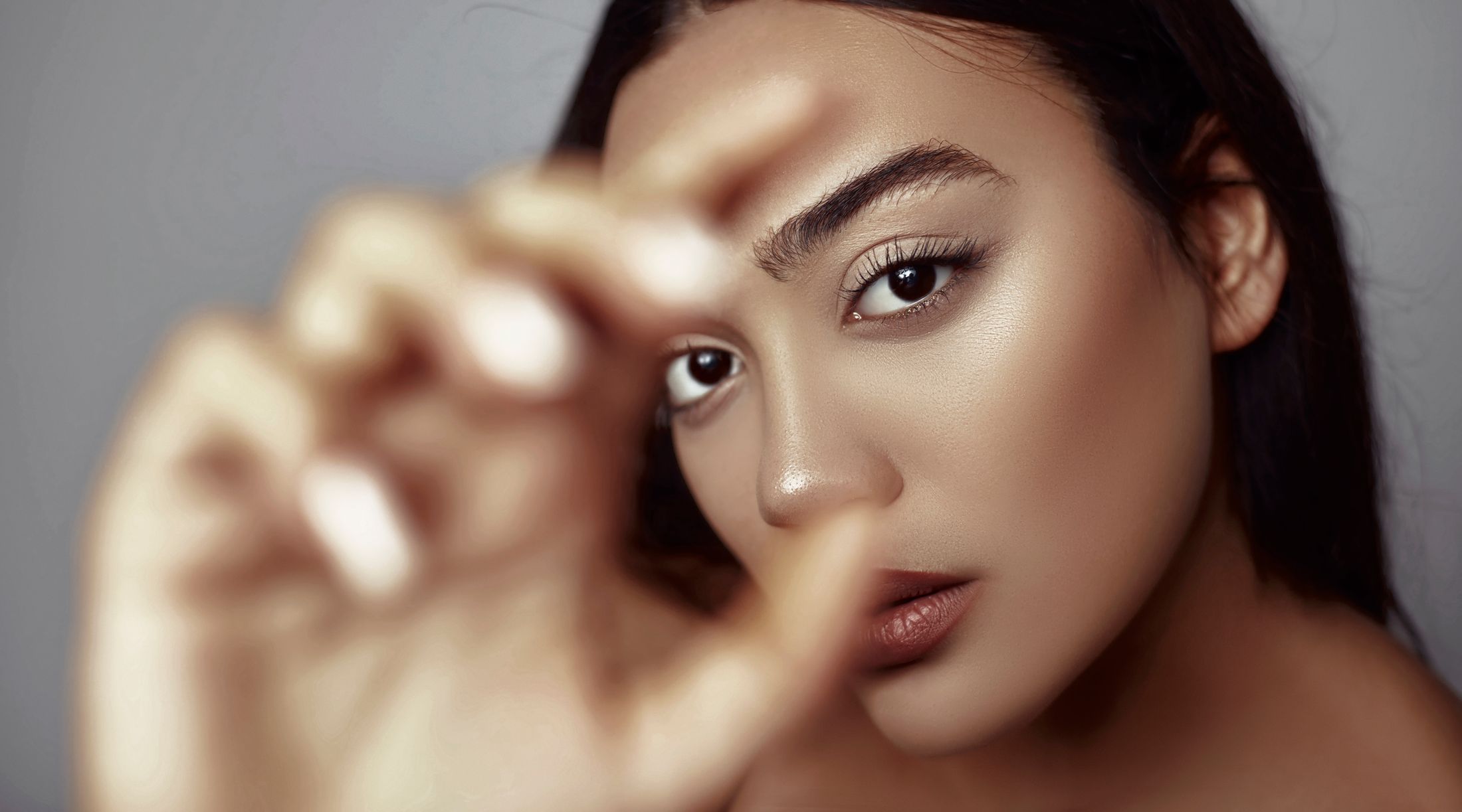 Close-up of a woman with expressive eyes.