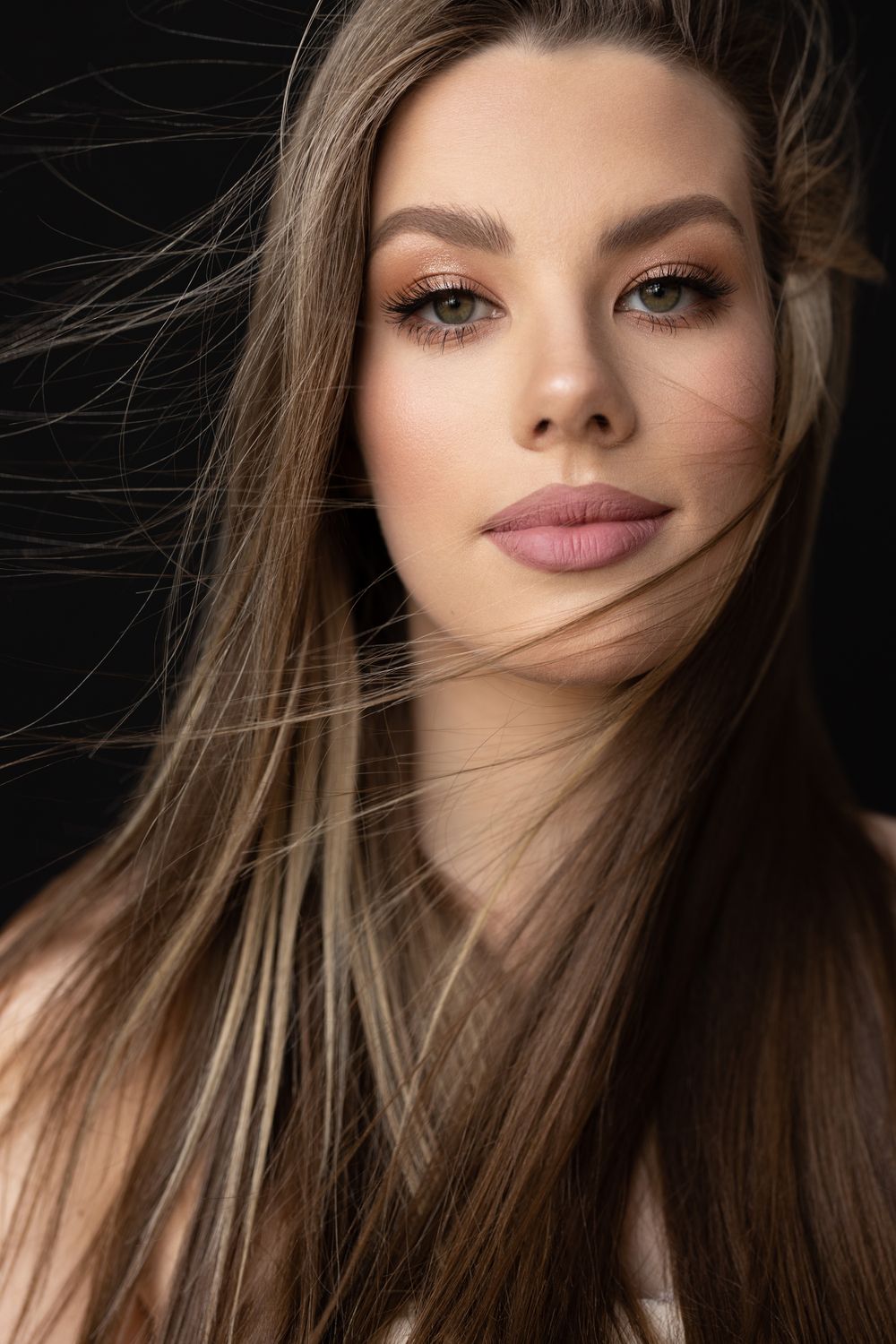 Portrait of a woman with flowing hair.
